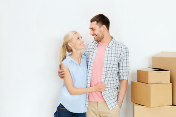 couple with cardboard boxes moving to new home