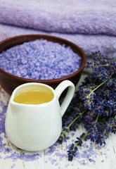 Fototapeta na wymiar lavender oil with bath salt and fresh lavender