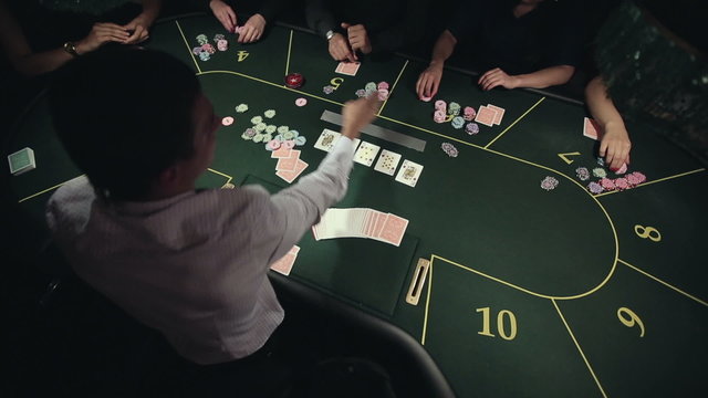 Casino, poker: Group of people in poker club gambling at poker card table. Time lapse