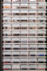 rows of plastic boxes for components