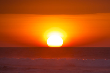 Ocean sunset on the beach and the Pacific Ocean in Punta Sal, Pe