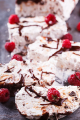 Semifreddo with meringue, raspberries and chocolate sauce.selective focus