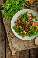 Potato gnocchi with salad and onions
