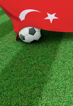 Soccer ball and national flag of Turkey,  green grass