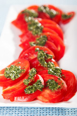 Tomatos with pesto sauce