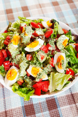 Summer salad with tomatos and boiled eggs
