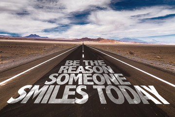 Be The Reason Someone Smiles Today written on desert road