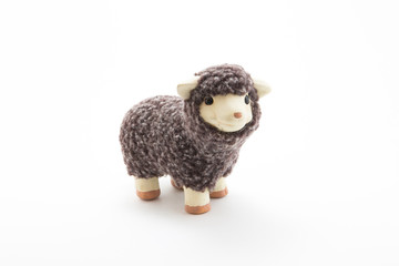 Fototapeta na wymiar Cute toy sheep with white background