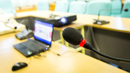 Obraz na płótnie Canvas Black conference microphone and computer used for meetings and t