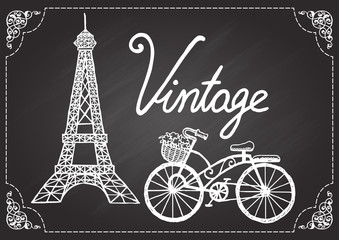 Fototapeta na wymiar Hand drawn Eiffel tower and vintage bicycle on chalkboard with ornamental swirl