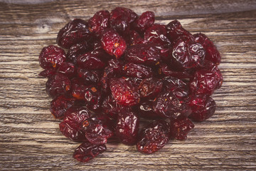 Vintage photo, Heap of red cranberries on wooden table