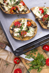 delicious bruschetta with tomatoes, cheese and mushrooms