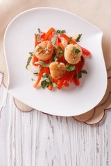 Grilled Scallops with peppers and herbs. Vertical top view
