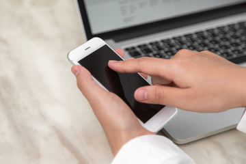 Woman hand hold smart phone with blank empty screen