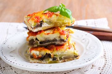 Courgette and eggplant cheese and tomato bake