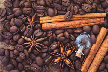 coffee beans, anise and cinnamon on table