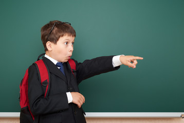 school boy portrait near board