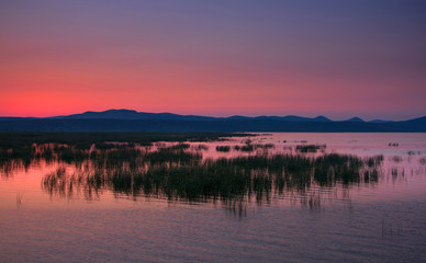 Beautiful and quiet lake at sunrise