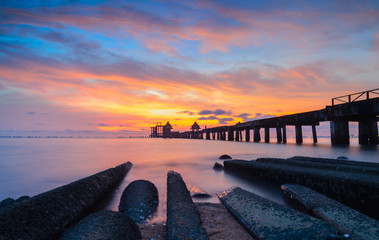 Wooded bridge in the port and sunset