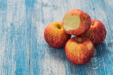 Apple four balls on the wooden floor.