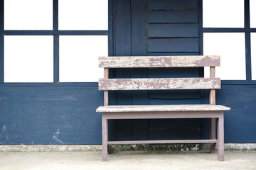 Old Wooden Bench with blue wall background