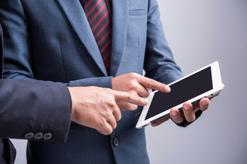 businessmen using tablet at meeting