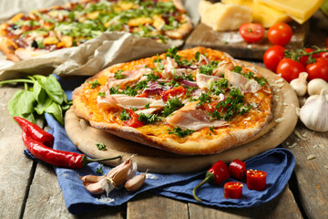 Tasty pizza with vegetables on table close up