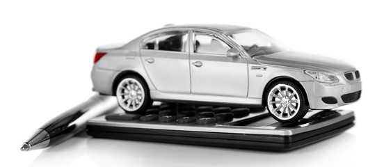 Pen, calculator and toy car isolated on white