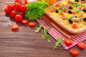 Delicious homemade pizza on table close-up