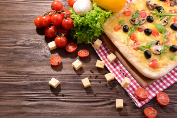Delicious homemade pizza on table close-up