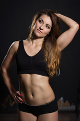 Fototapeta na wymiar Sports woman in gym