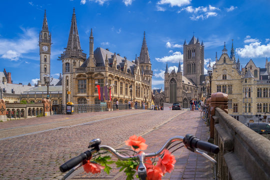 Blue sky over Gent, Belgium, with a traditionally decorated bicycle in the foreground