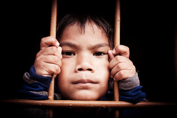 asian boy Hand in jail,vintage tone