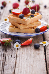 Waffles with strawberries and blueberries  for Breakfast,Belgian.Copy space. selective focus