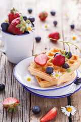 Waffles with strawberries and blueberries  for Breakfast,Belgian.selective focus