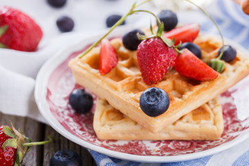 Waffles with strawberries and blueberries  for Breakfast,Belgian.selective focus