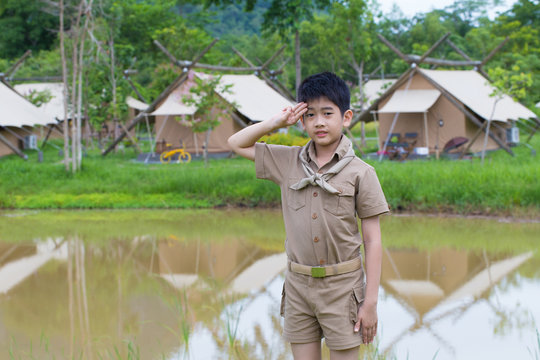 Boy Scout, A Thai Asian Boy Scout In Uniform With Cheerful Smile Stand At Salute