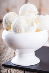 Ice cream, white cream in a white ceramic bowl.selective focus