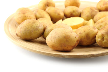 Young potatoes on plate close up