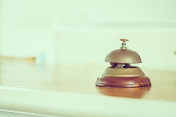 Vintage service bell at hotel reception - vintage filter