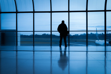 Fototapeta na wymiar silhouette of a man at the airport
