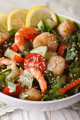 salad with shrimp, scallops and fresh vegetables close up. Vertical
