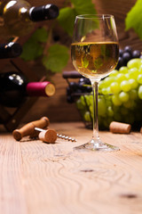 Glass of white wine, served with grapes