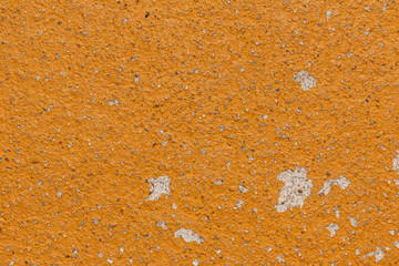 Yellow cracked painted old cement texture.