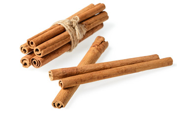 bundle of cinnamon sticks on white. (large depth of field, taken with tilt shift lens)