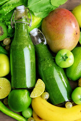 Green healthy juice with fruits and vegetables close up