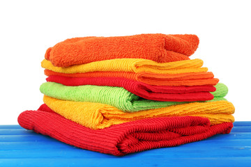 Colorful towels on light background