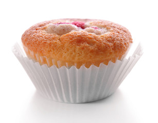 Delicious cupcake with berries isolated on white