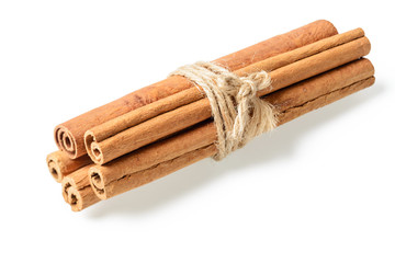 bundle of cinnamon sticks on white. (large depth of field, taken with tilt shift lens)