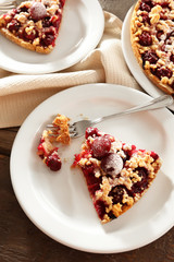 Tasty homemade pie with cherries on table close up